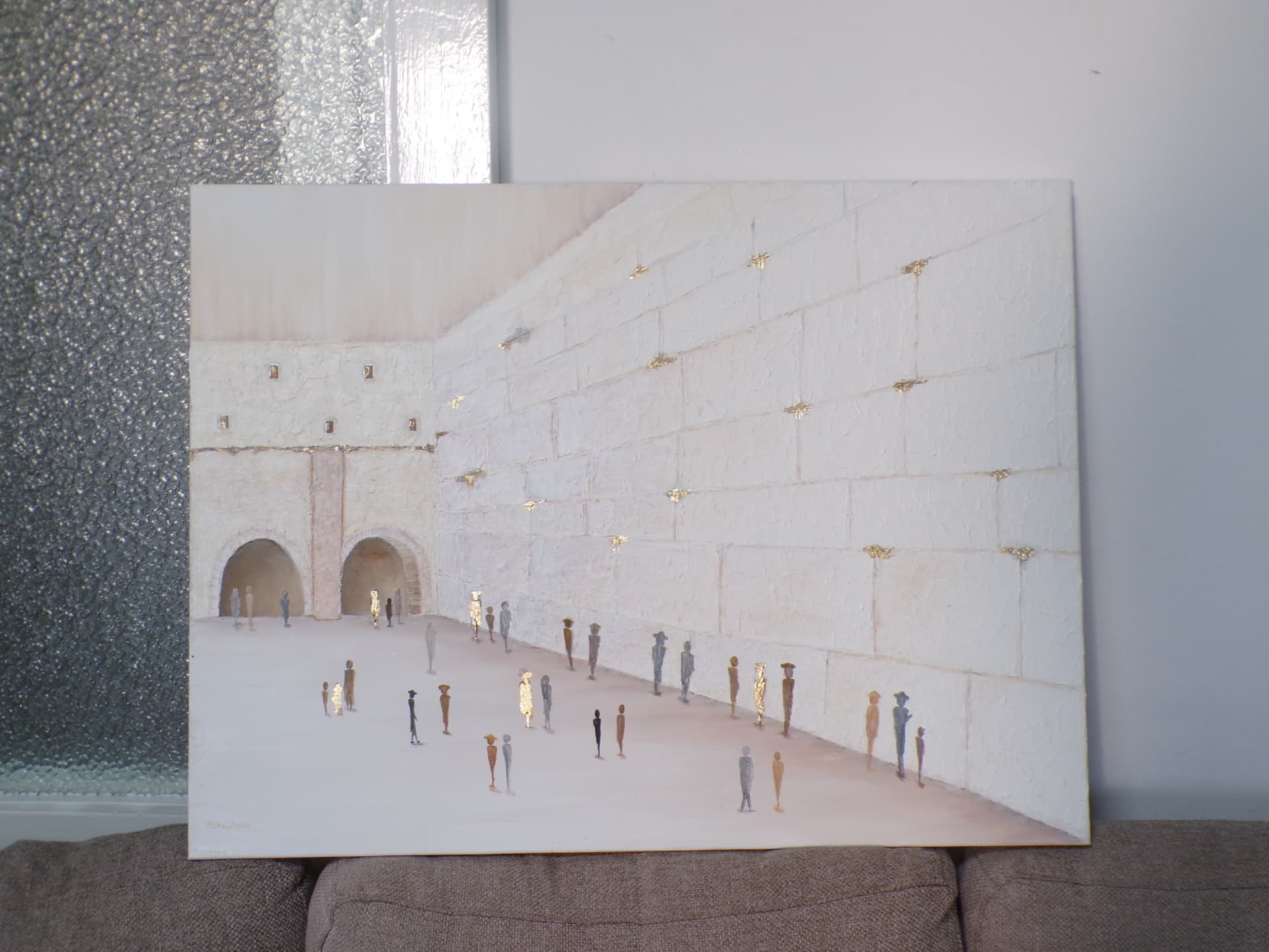 Student painting of the Kotel plaza with gold-leaf figures