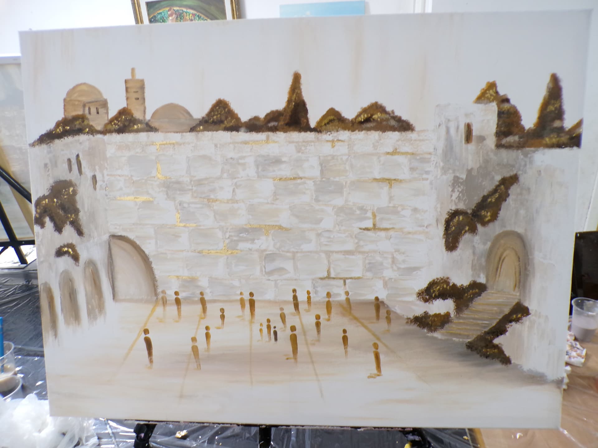 Student painting of the Kotel in warm white and gold