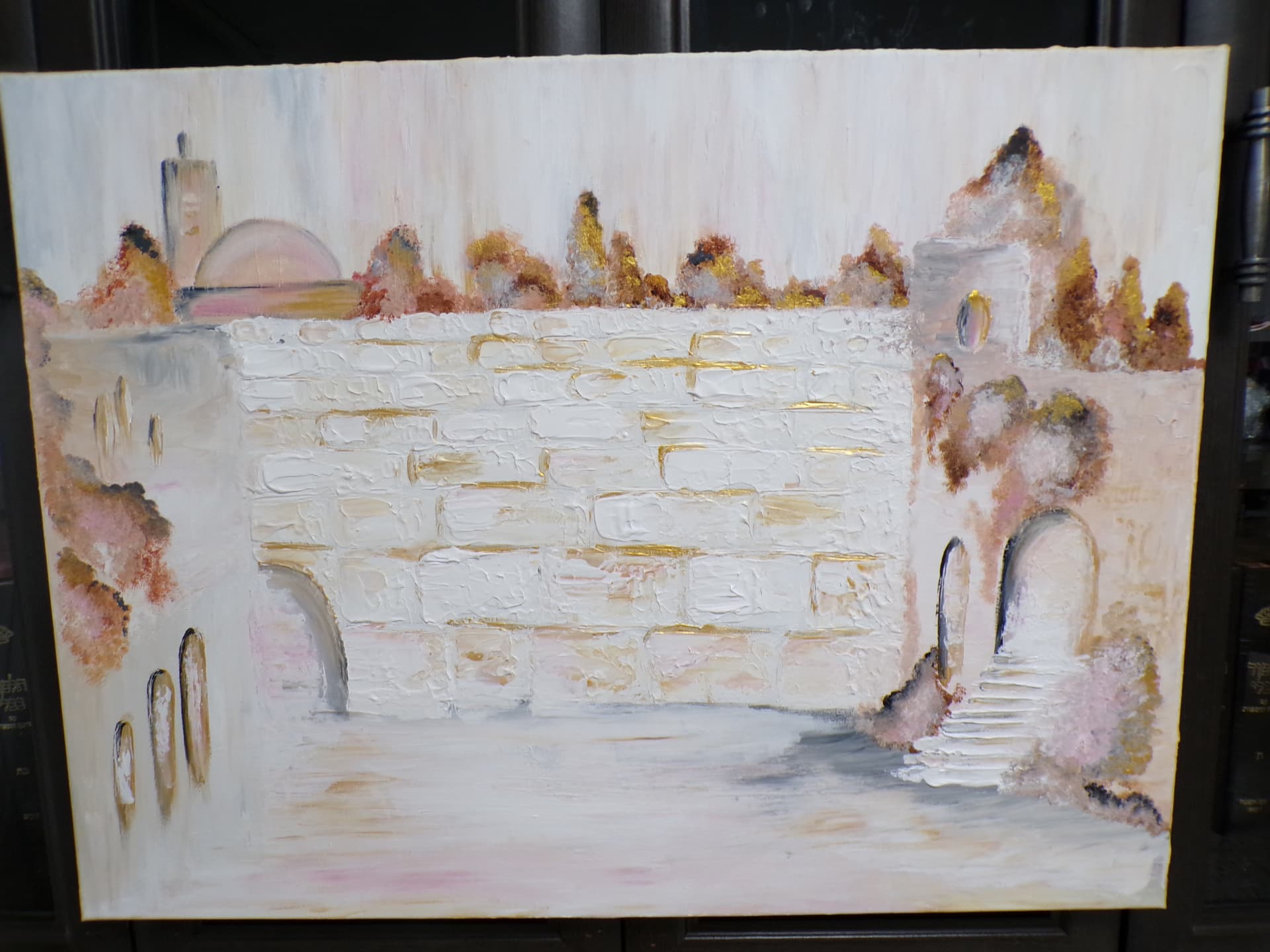 Student painting of the Kotel in blush pink, white, and gold